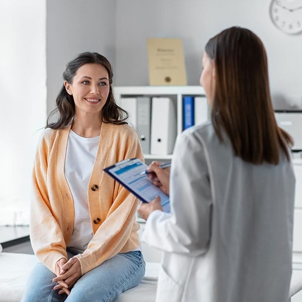 A person seeking help from a mental health professional, pondering do I need mental health treatment.