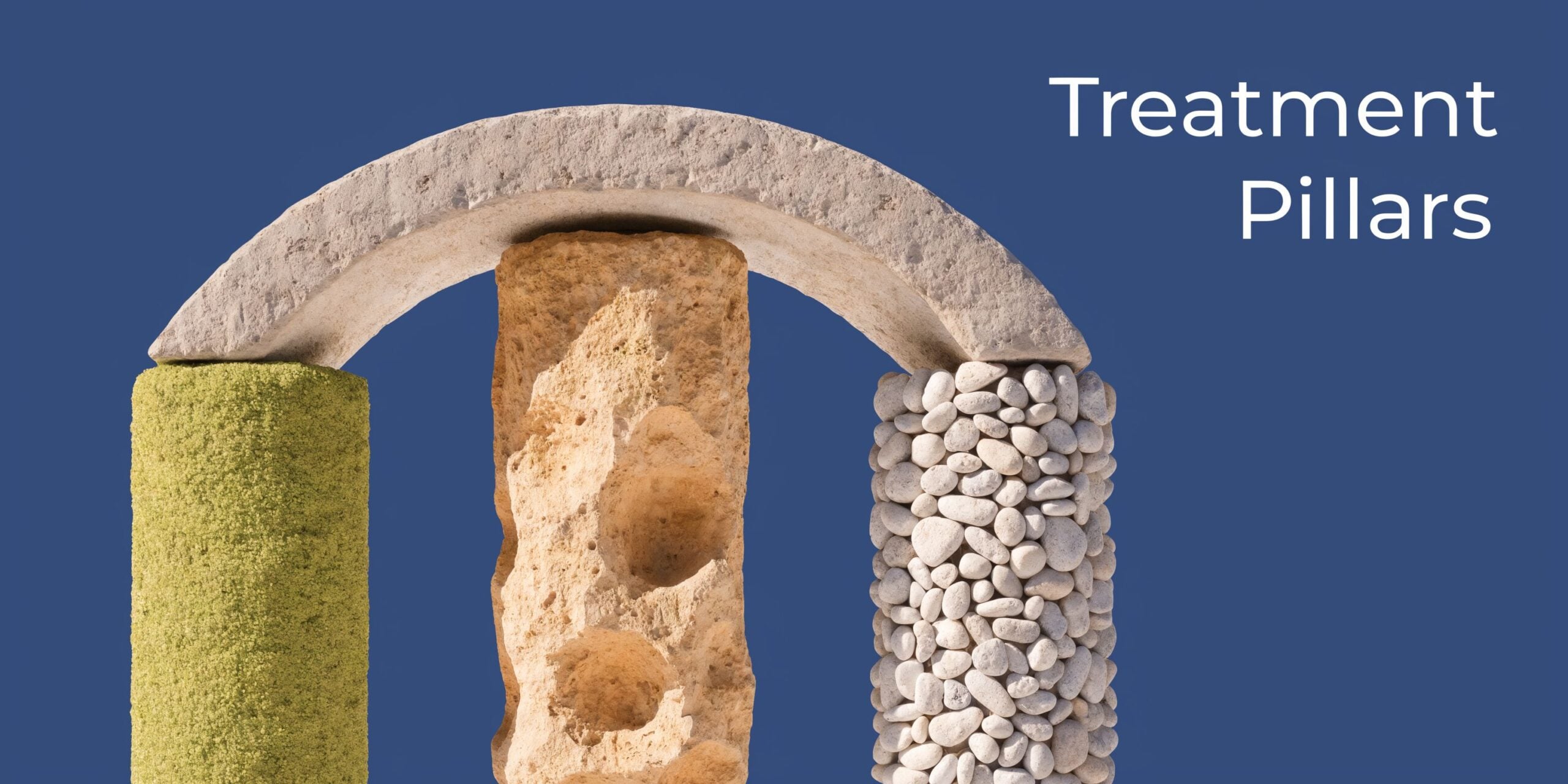 Three different textured stone pillars supporting a large stone arch against a solid blue background.
